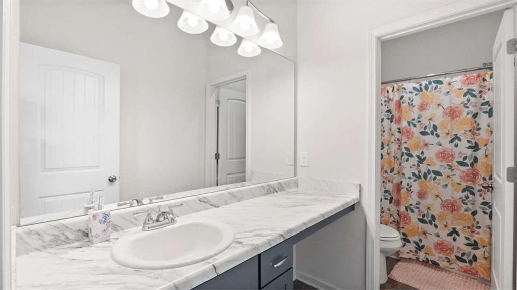 13 Maycroft Court Rome, GA 30161 - Photo 14 of 28 a bathroom with a granite countertop sink and a mirror
