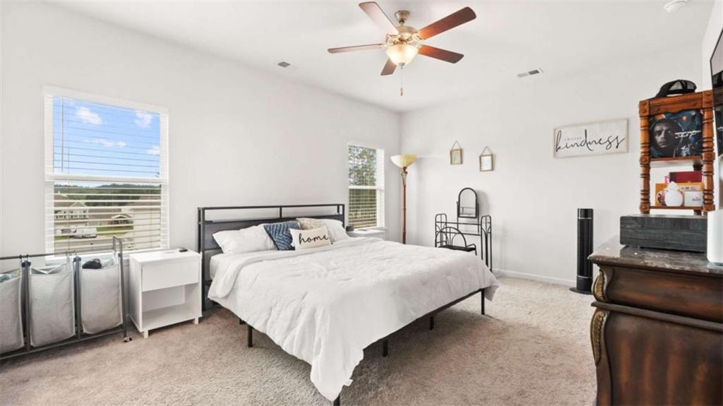 13 Maycroft Court Rome, GA 30161 - Photo 17 of 28 a bedroom with a bed flat screen tv and a window