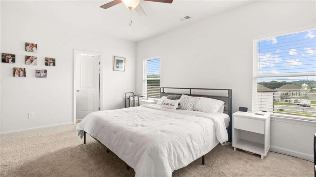 13 Maycroft Court Rome, GA 30161 - Photo 18 of 28 a bedroom with a bed and a window