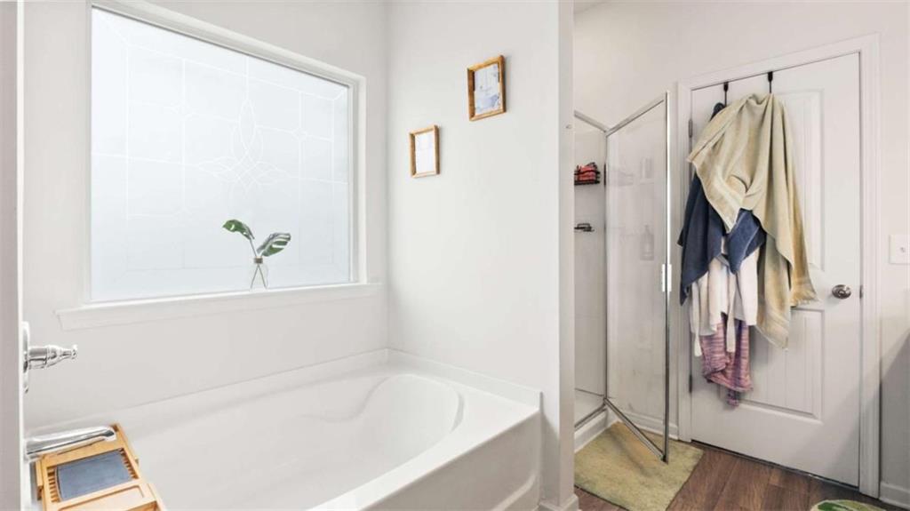 13 Maycroft Court Rome, GA 30161 - Photo 22 of 28 a bathroom with a bathtub and a shower