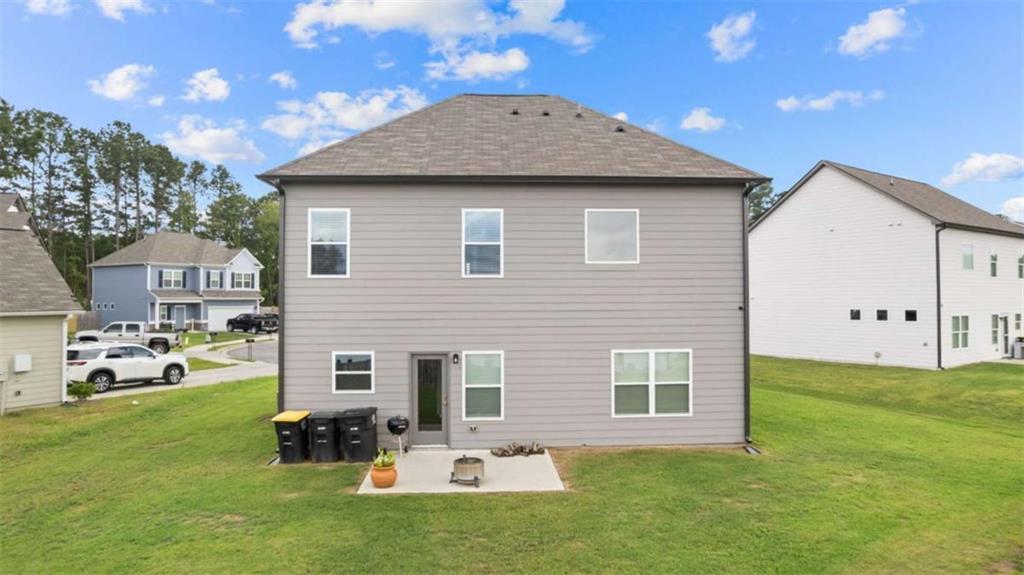 13 Maycroft Court Rome, GA 30161 - Photo 24 of 28 a backyard of a house with table and chairs