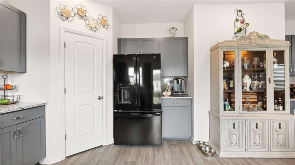 13 Maycroft Court Rome, GA 30161 - Photo 8 of 28 a kitchen with a refrigerator and cabinets