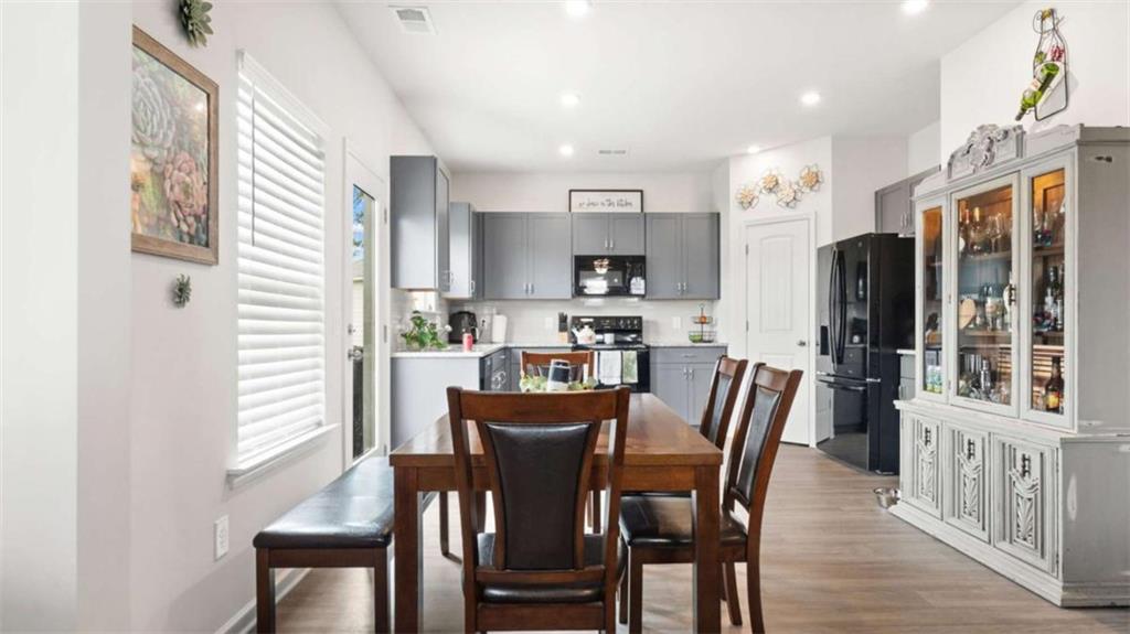 13 Maycroft Court Rome, GA 30161 - Photo 9 of 28 a view of a dining room with furniture window and wooden floor
