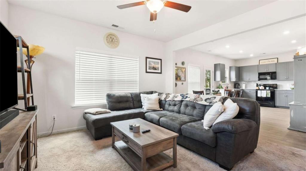 13 Maycroft Court Rome, GA 30161 - Photo 10 of 28 a living room with furniture and a flat screen tv