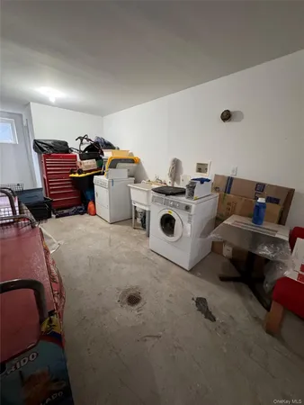 a living room with furniture and a lamp