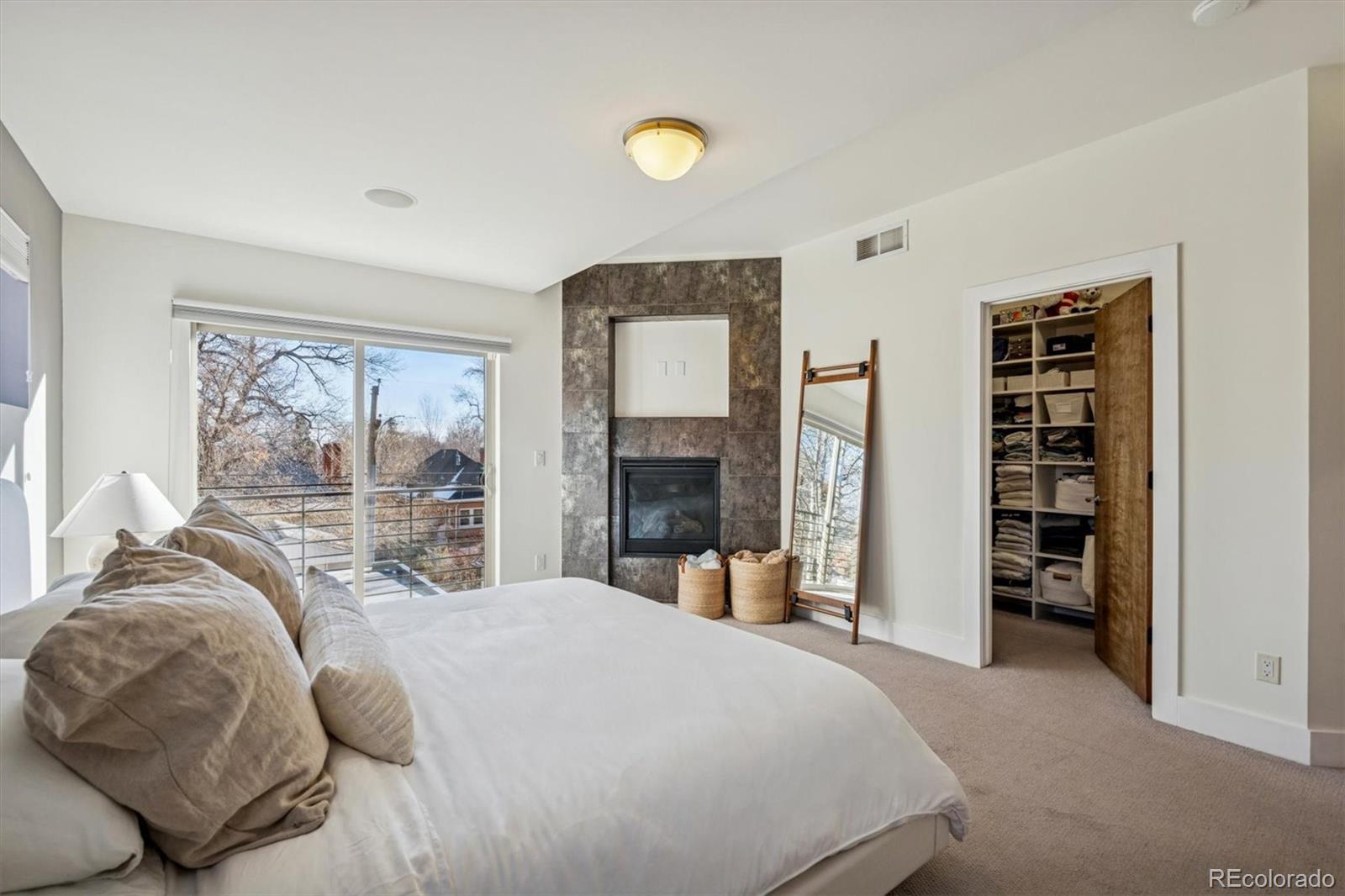 3422 Newton Street Denver, CO 80211 - Photo 16 of 37 a bedroom with a bed and a large window