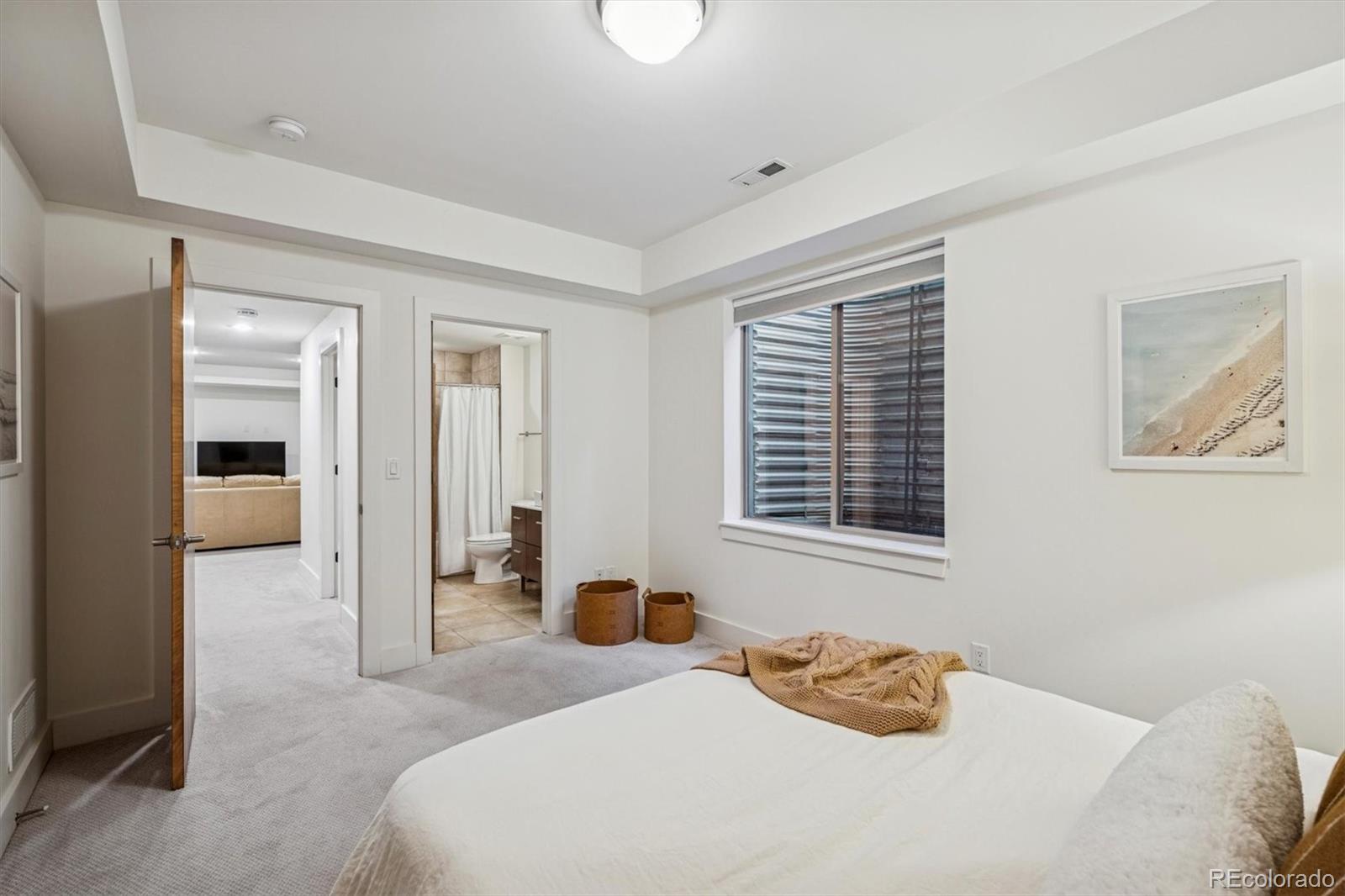 3422 Newton Street Denver, CO 80211 - Photo 28 of 37 a bedroom with a bed and a window