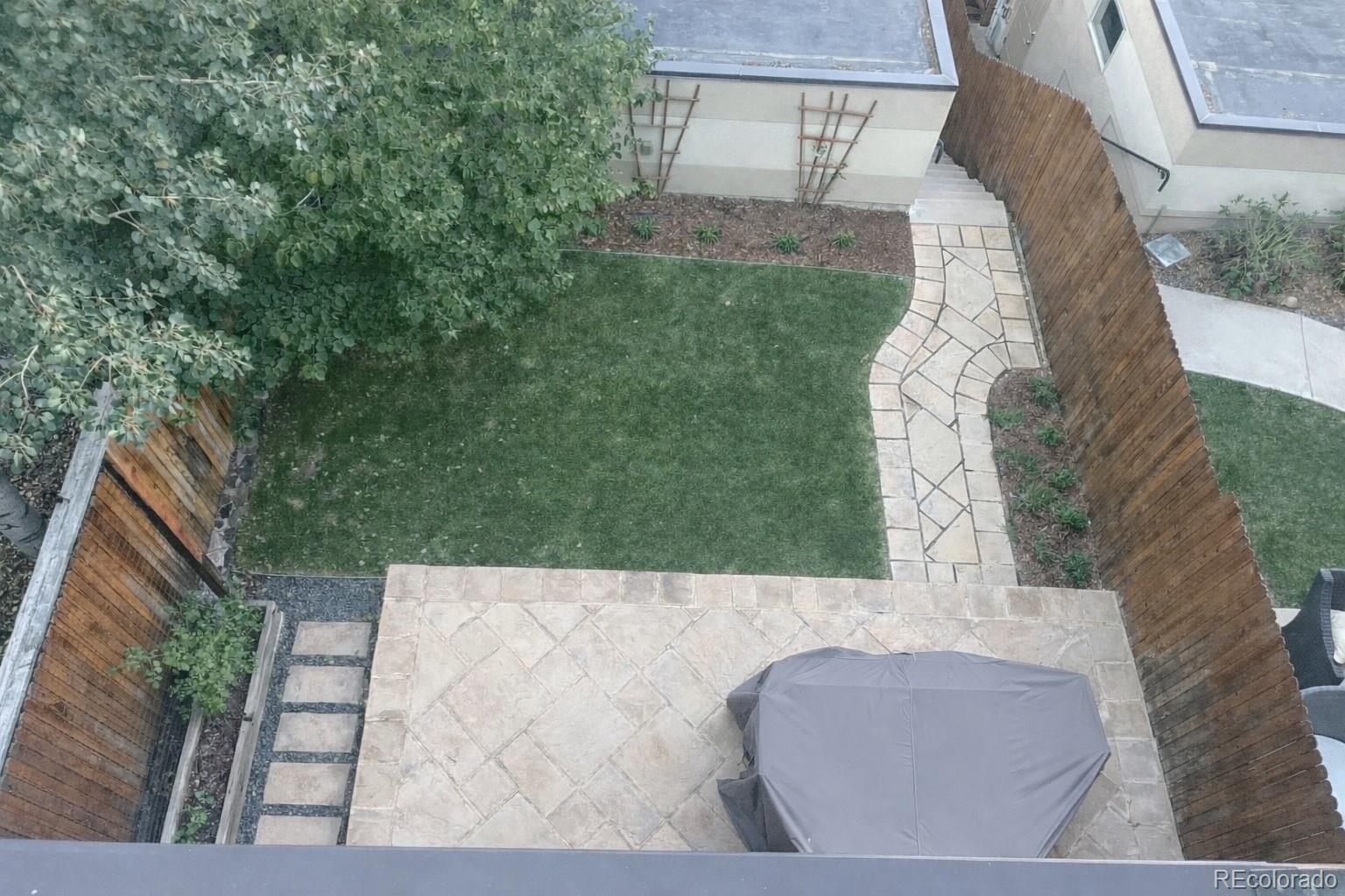 3422 Newton Street Denver, CO 80211 - Photo 30 of 37 a view of backyard with outdoor seating and green space