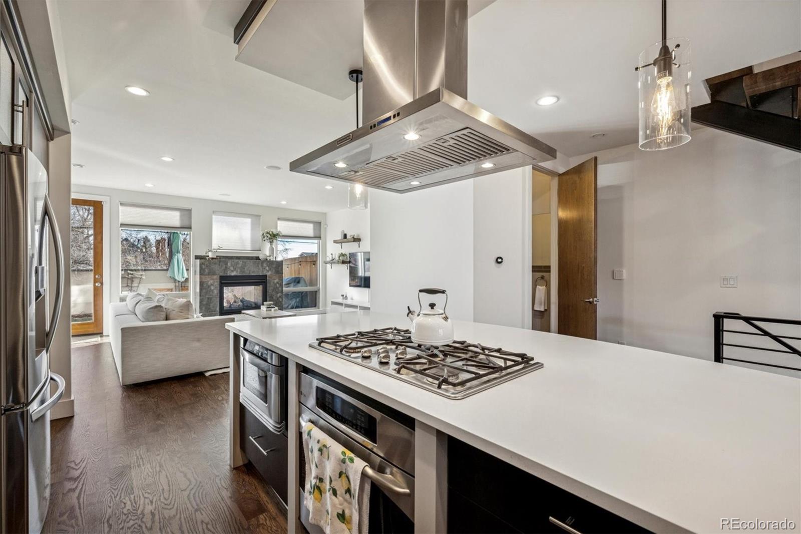 3422 Newton Street Denver, CO 80211 - Photo 10 of 37 a kitchen with a stove and a refrigerator