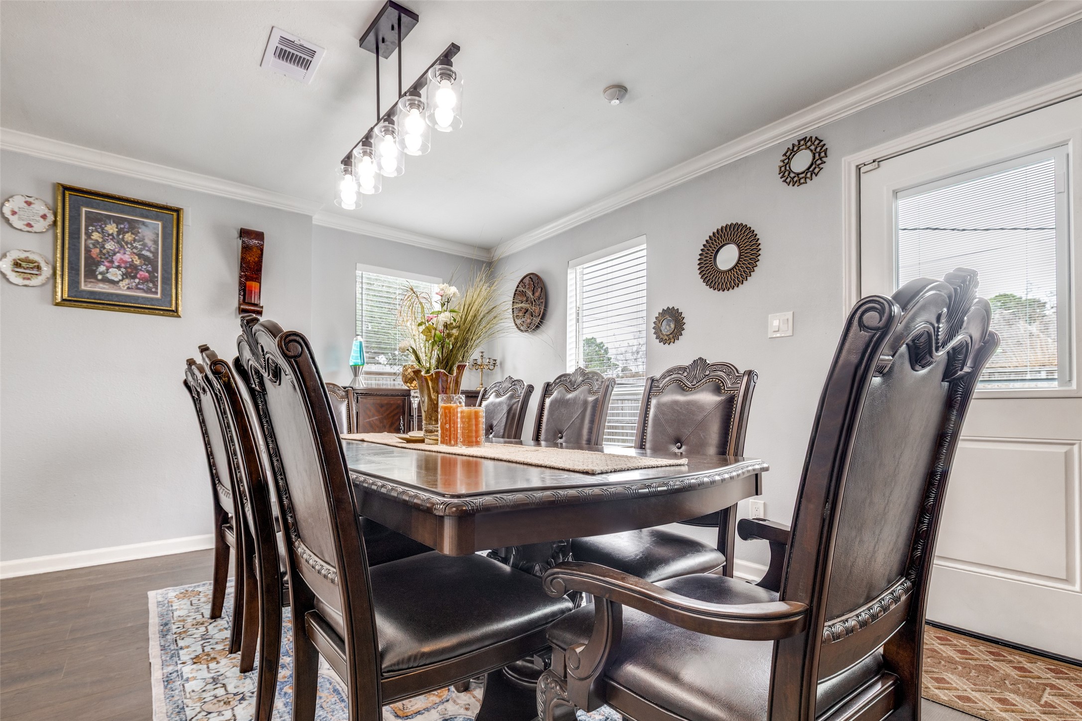 605 South Remington Drive Angleton, TX 77515 - Photo 12 of 25 a view of a dining room with furniture and a chandelier