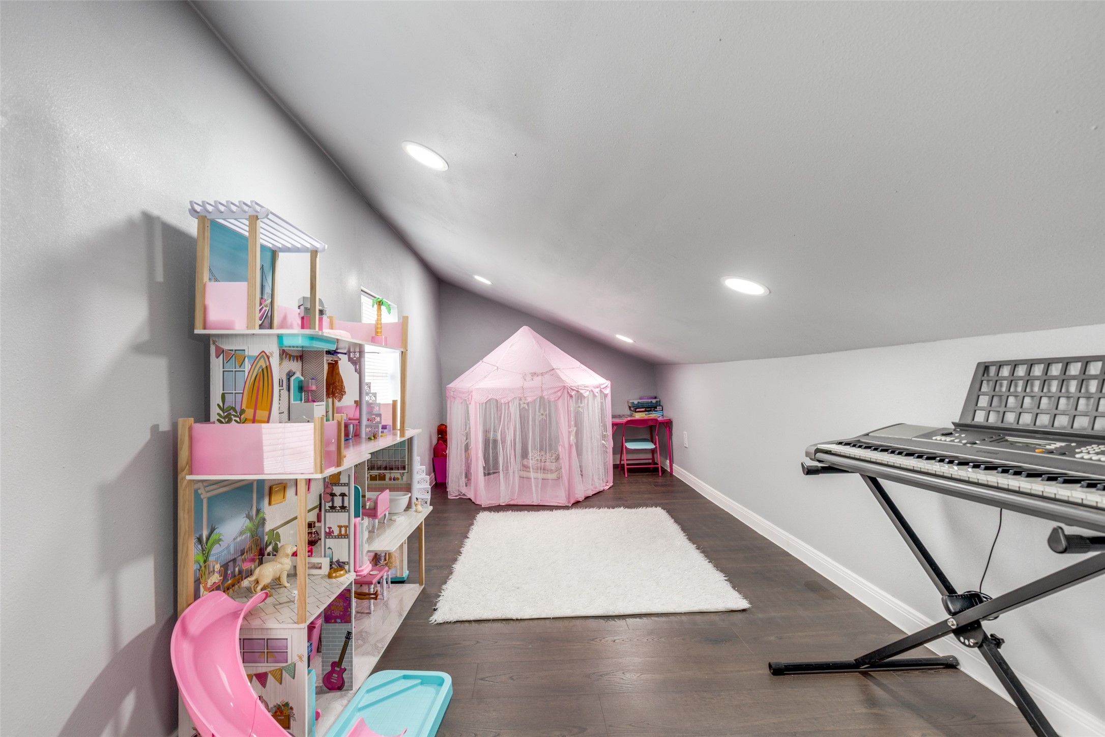 605 South Remington Drive Angleton, TX 77515 - Photo 13 of 25 a room with lots of white furniture and a wooden floor