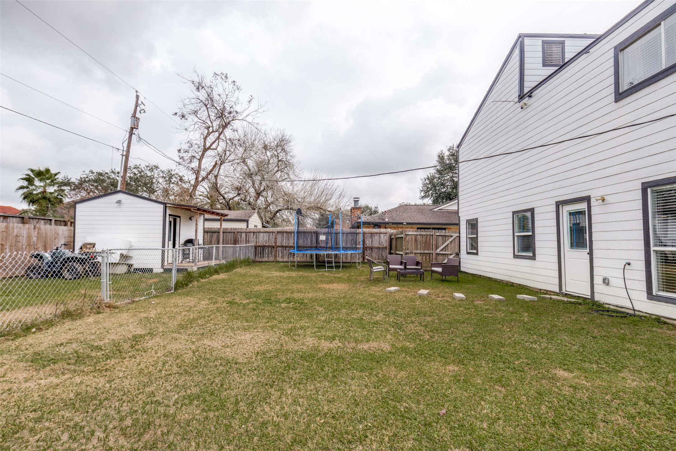 605 South Remington Drive Angleton, TX 77515 - Photo 23 of 25 a swimming pool with outdoor seating and yard