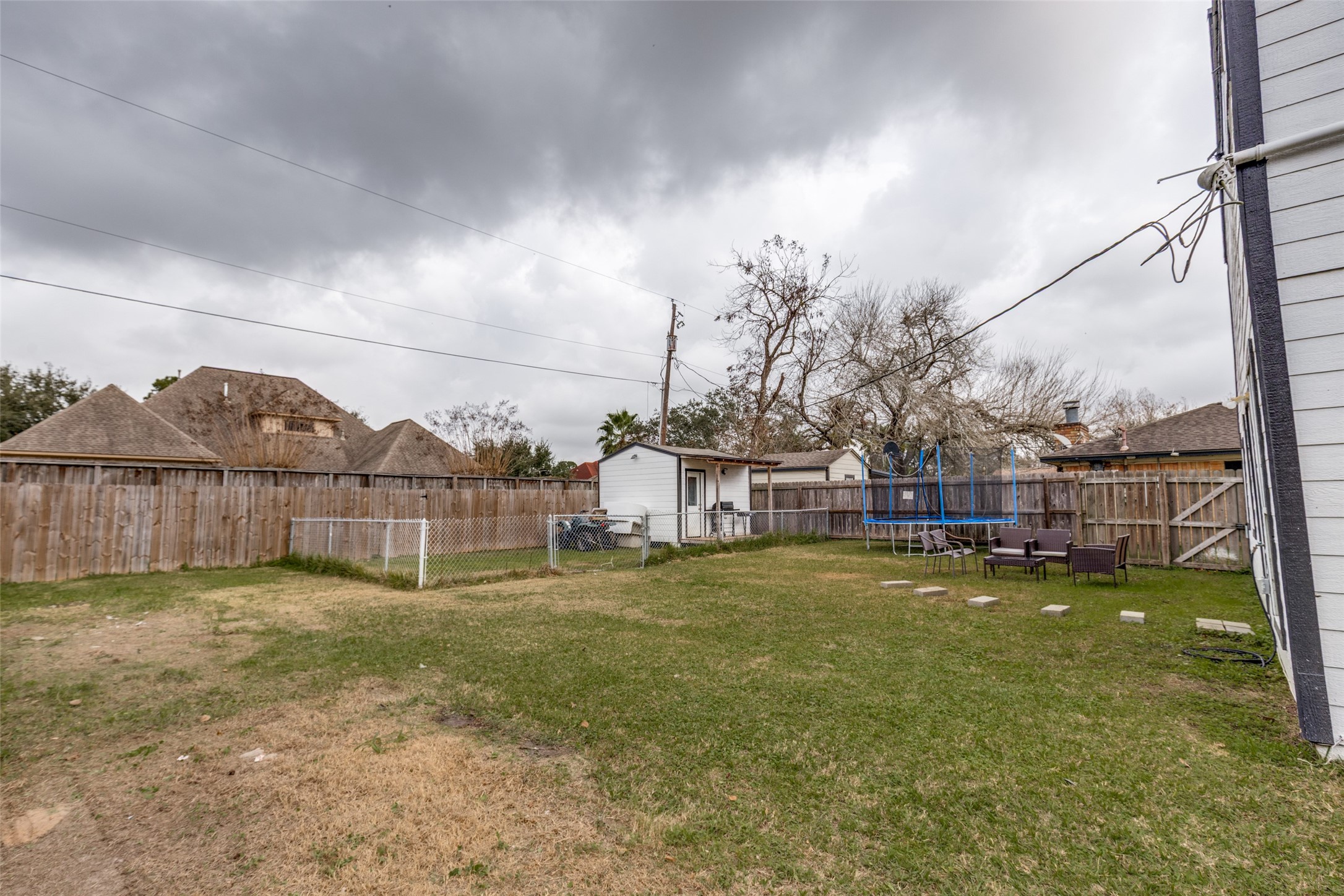 605 South Remington Drive Angleton, TX 77515 - Photo 24 of 25 a view of a house with a yard and a large tree