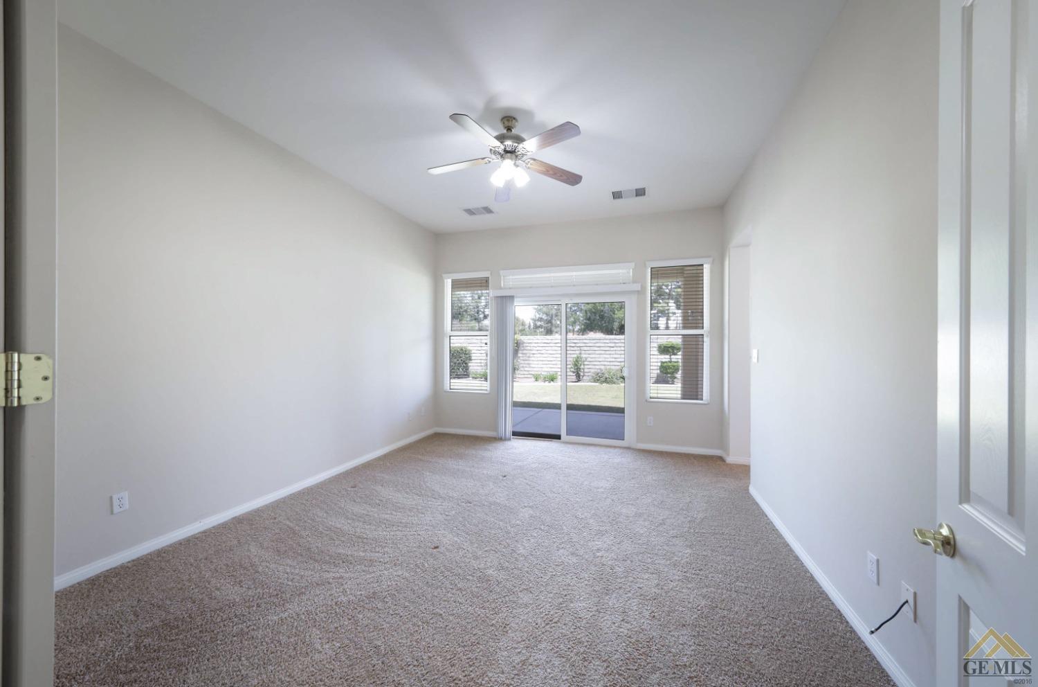 Undisclosed Address Bakersfield, CA 93311 - Photo 12 of 34 a view of a livingroom with a ceiling fan
