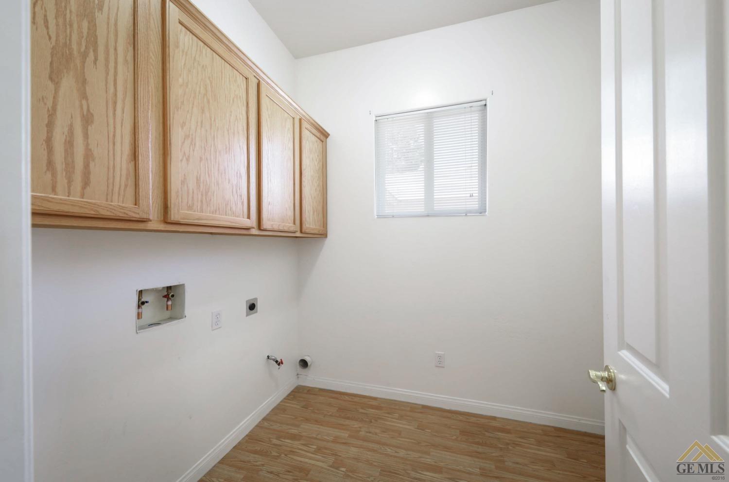 Undisclosed Address Bakersfield, CA 93311 - Photo 23 of 34 a view of storage and utility room with wooden floor