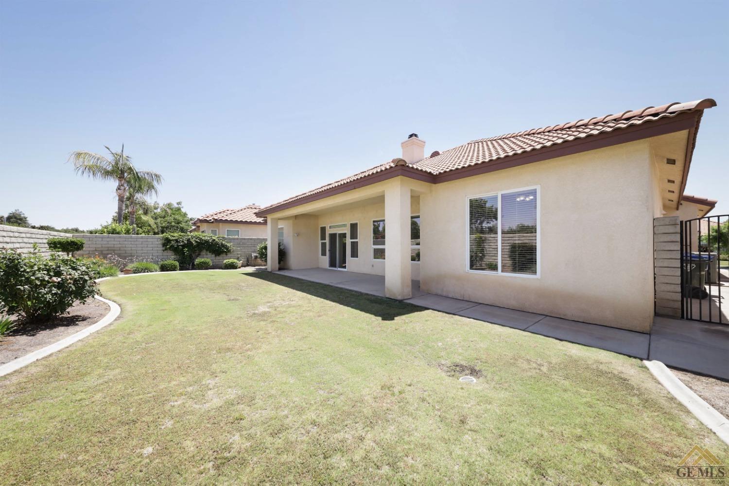 Undisclosed Address Bakersfield, CA 93311 - Photo 30 of 34 a view of a house with a backyard