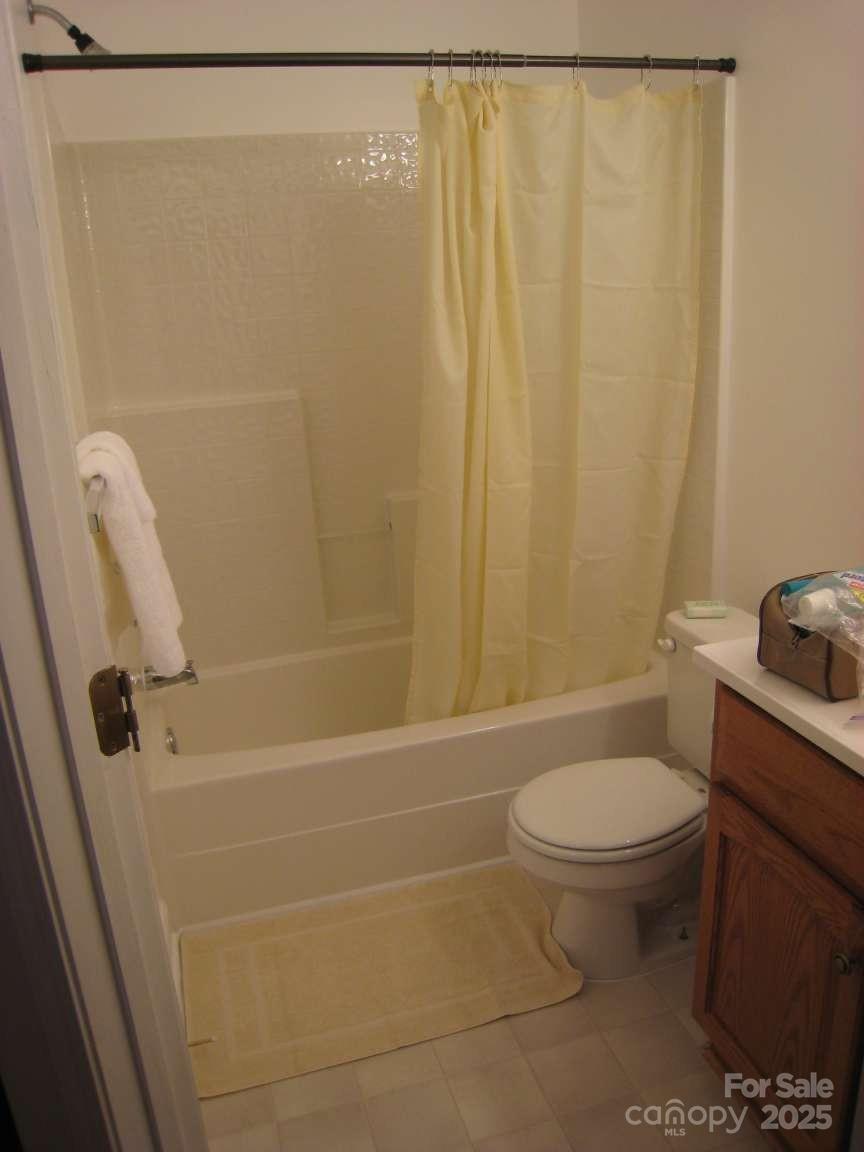4653 Perkins Road Charlotte, NC 28269 - Photo 14 of 16 a bathroom with a sink a toilet and shower