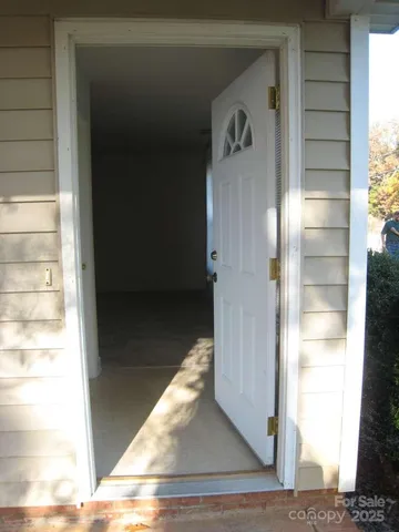 a view of a room with a table and chairs