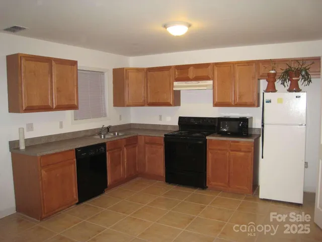 a view of storage and utility room with washer and dryer