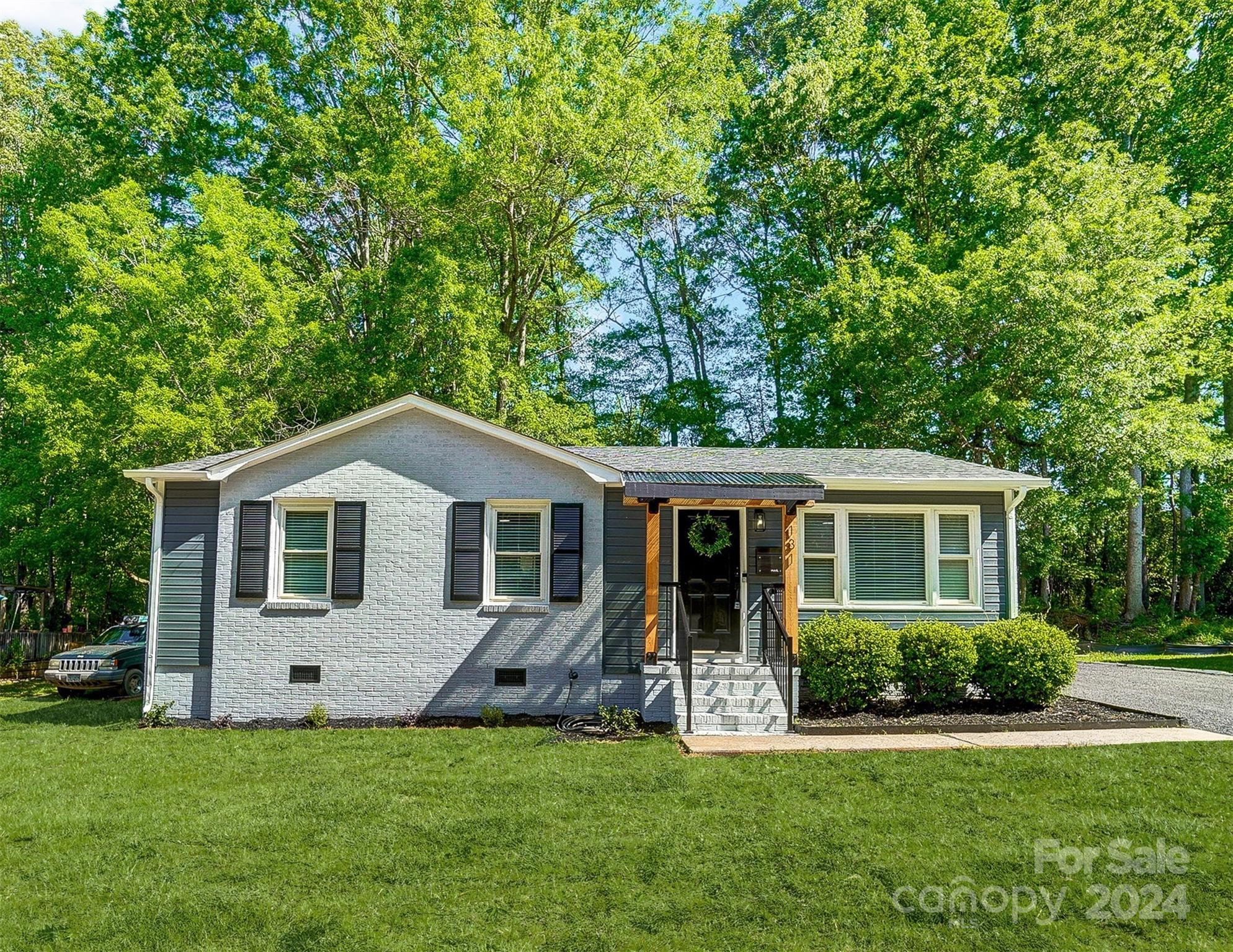 131 Hickory Lane York, SC 29745 - Photo 22 of 25 a front view of a house with a garden