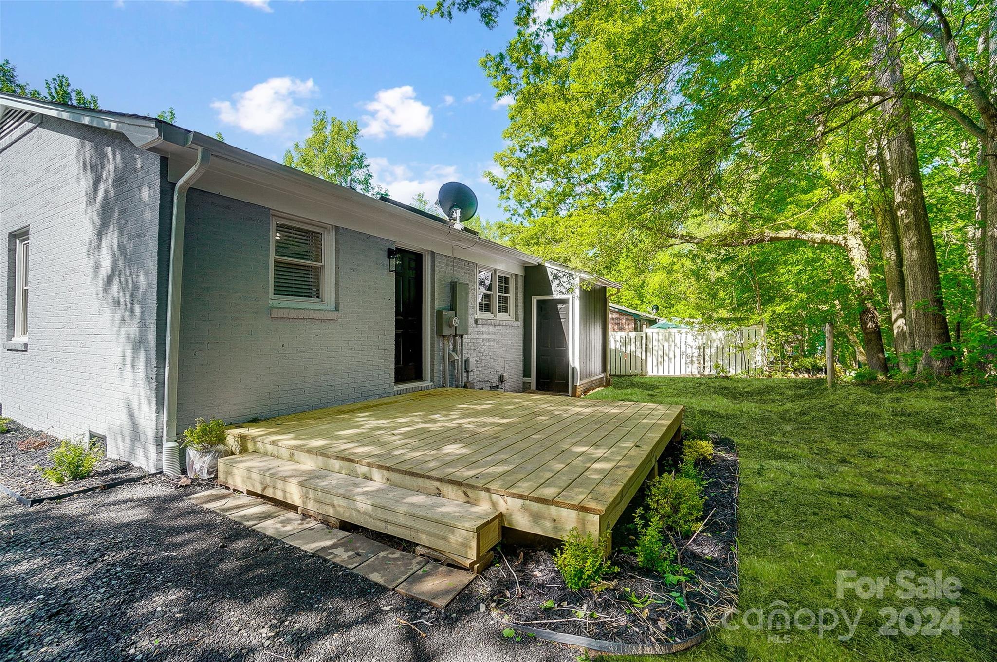 131 Hickory Lane York, SC 29745 - Photo 24 of 25 a view of a backyard with potted plants
