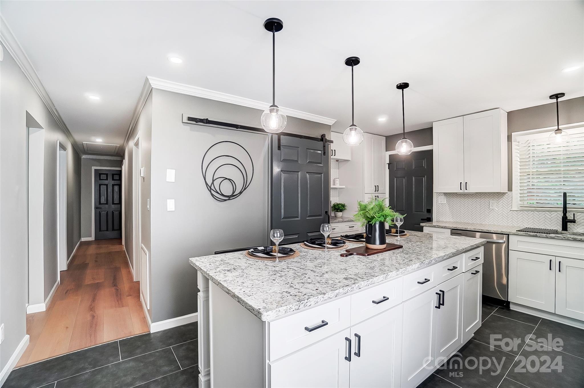 131 Hickory Lane York, SC 29745 - Photo 3 of 25 a kitchen with granite countertop a sink a stove and cabinets