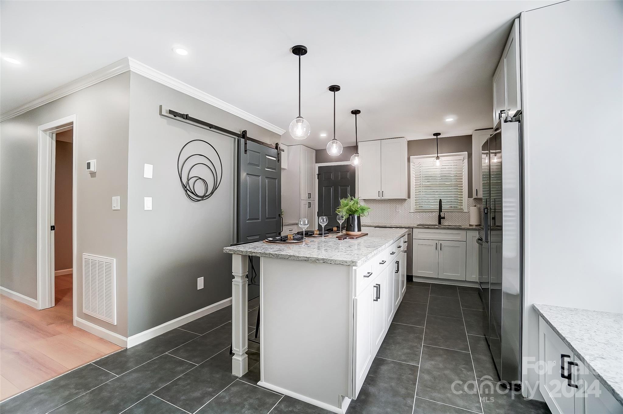 131 Hickory Lane York, SC 29745 - Photo 5 of 25 a kitchen with kitchen island granite countertop a sink a counter top space and stainless steel appliances