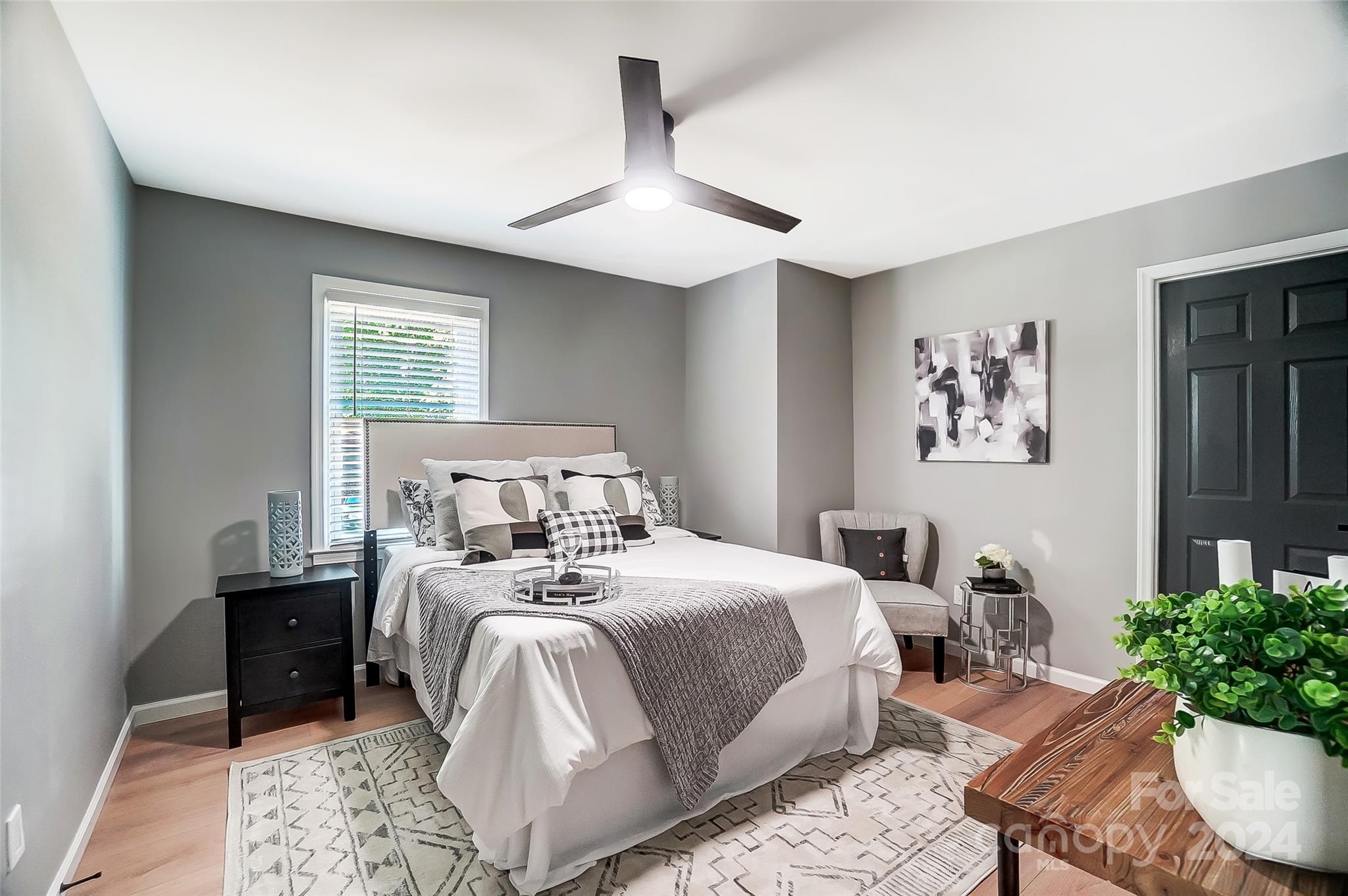131 Hickory Lane York, SC 29745 - Photo 10 of 25 a bedroom with a bed and a potted plant