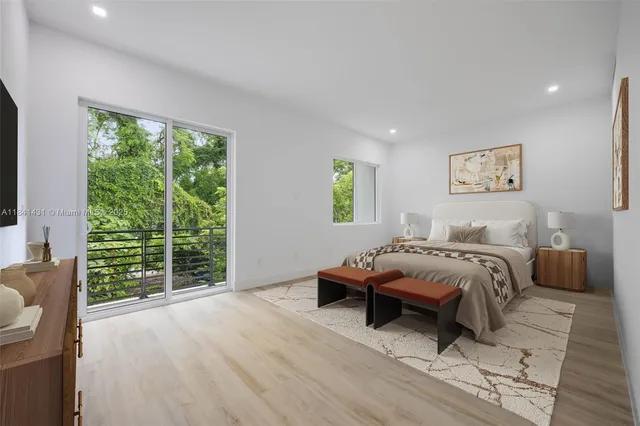 a bed room with a bed and a chair