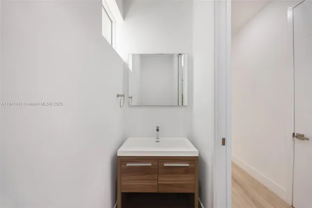 a bathroom with a sink and a mirror