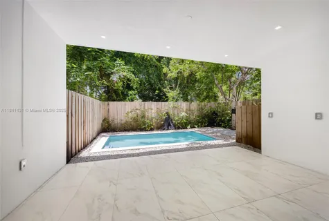 a view of backyard with green space