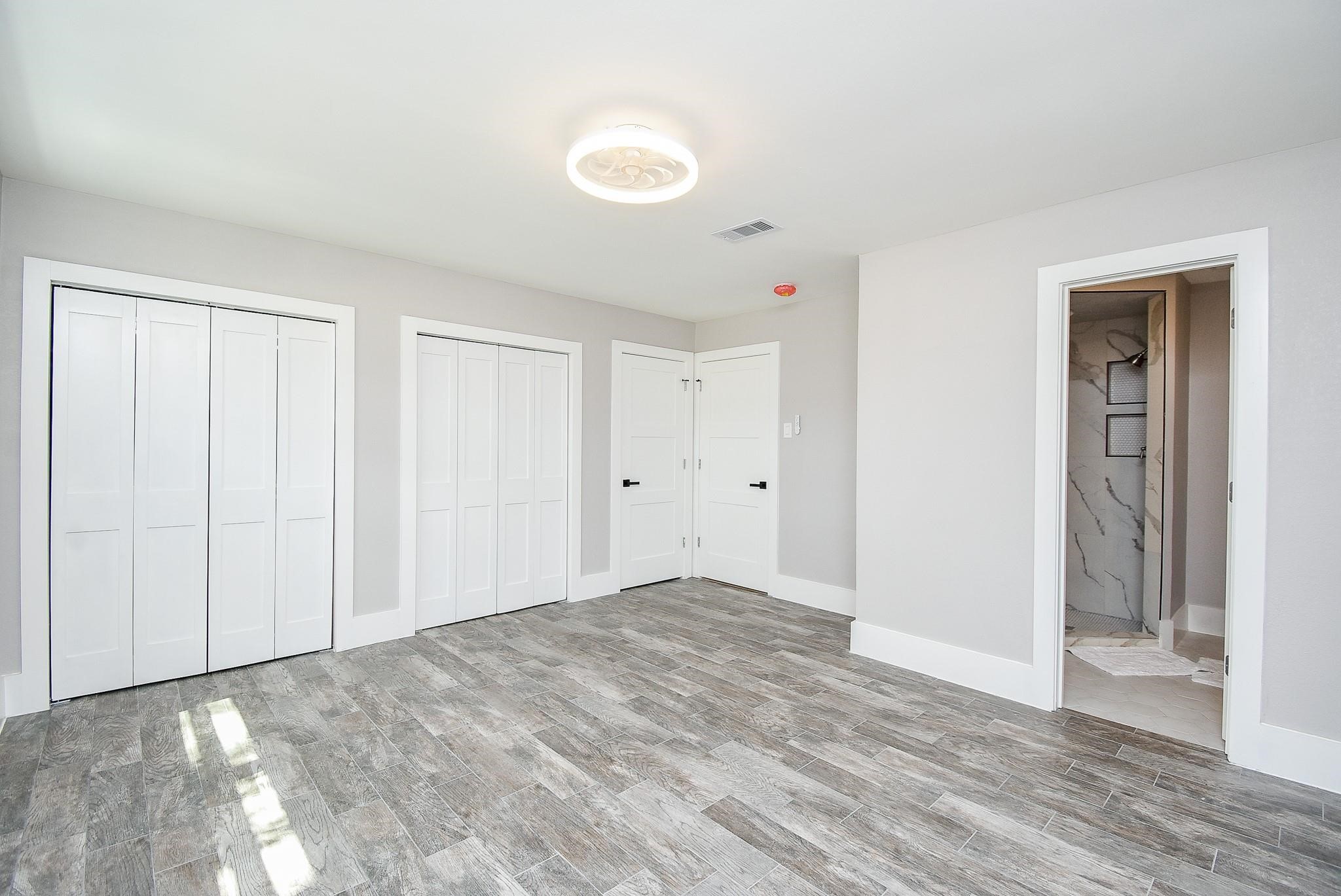 7618 Highmeadow Drive Houston, TX 77063 - Photo 11 of 48 a view of an empty room and wooden floor