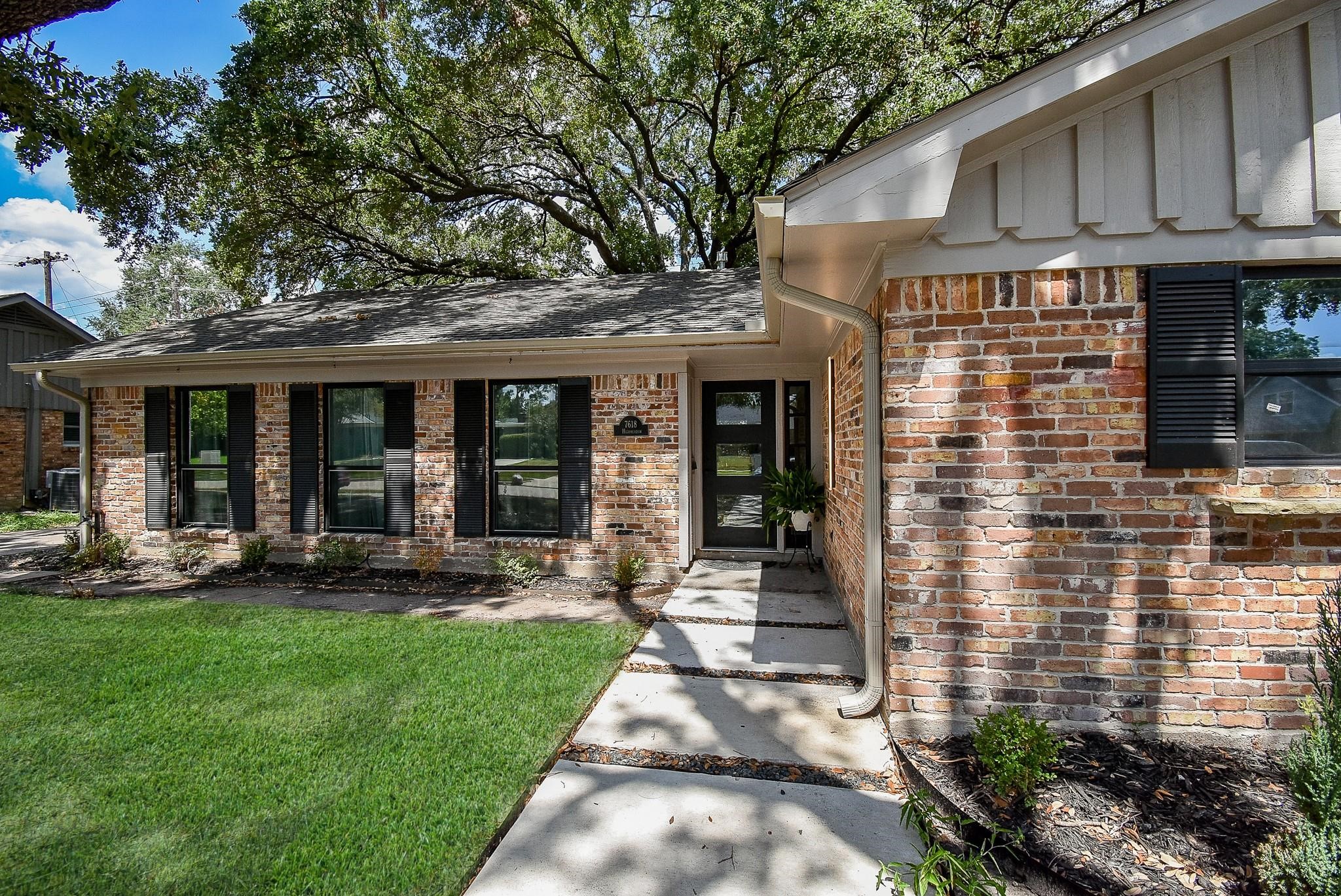 7618 Highmeadow Drive Houston, TX 77063 - Photo 13 of 48 a front view of a house with a yard and green space