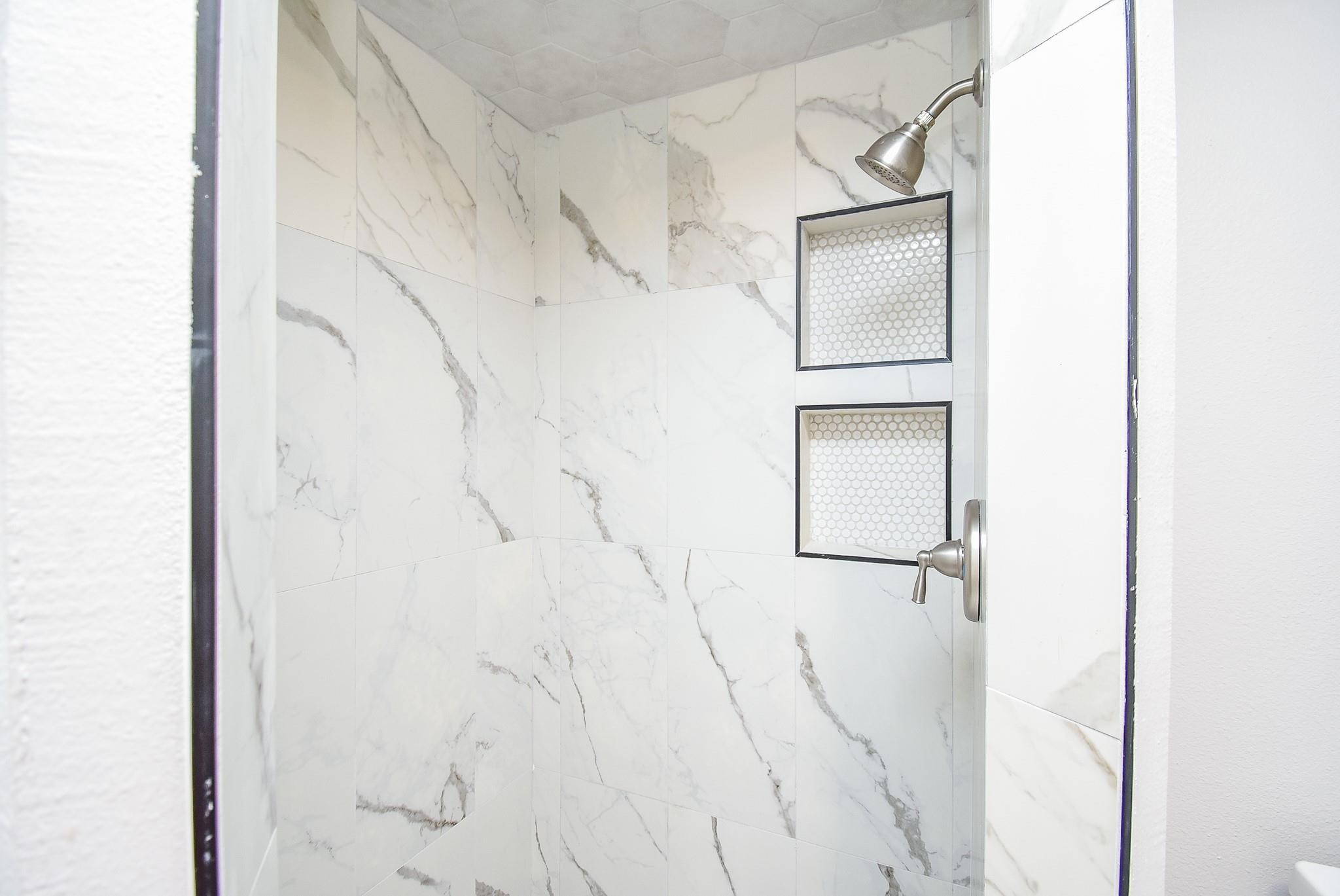 7618 Highmeadow Drive Houston, TX 77063 - Photo 22 of 48 a bathroom with a shower