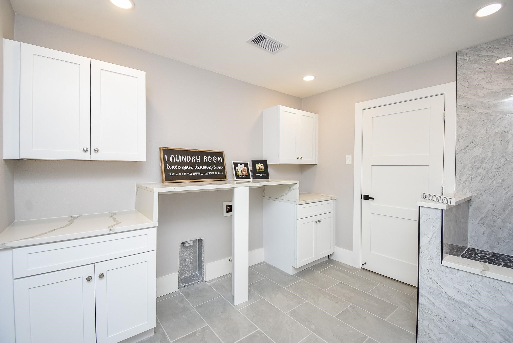 7618 Highmeadow Drive Houston, TX 77063 - Photo 33 of 48 a kitchen with white cabinets and white appliances