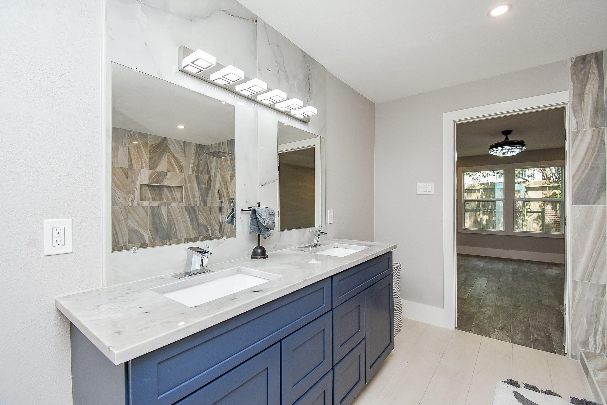 7618 Highmeadow Drive Houston, TX 77063 - Photo 43 of 48 a bathroom with a sink double vanity and a mirror