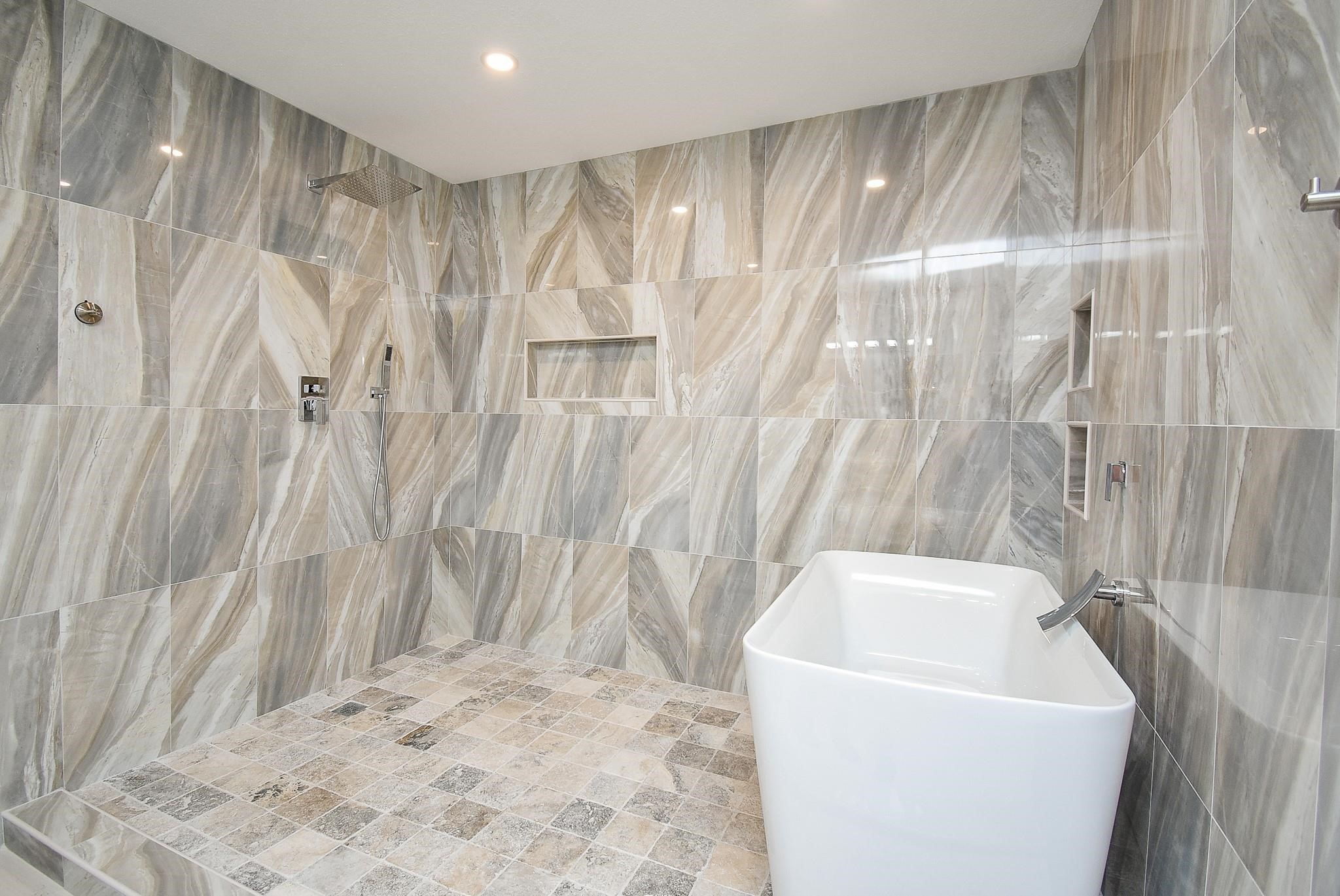 7618 Highmeadow Drive Houston, TX 77063 - Photo 44 of 48 a bathroom with a bathtub and shower