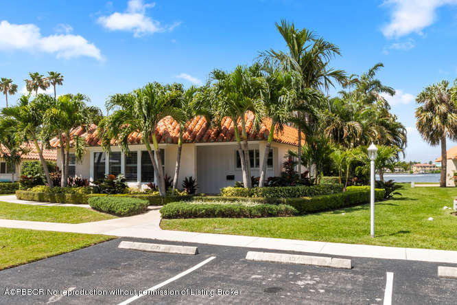 1371 Lands End Road Lantana, FL 33462 - Photo 1 of 39 a front view of a house with garden