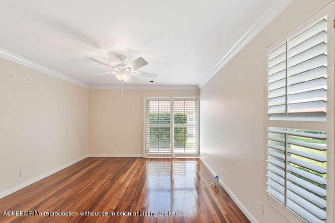 1371 Lands End Road Lantana, FL 33462 - Photo 4 of 39 a view of a room with wooden floor and fan