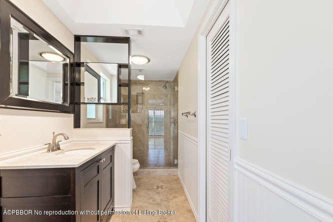 1371 Lands End Road Lantana, FL 33462 - Photo 5 of 39 a bathroom with a sink and a mirror