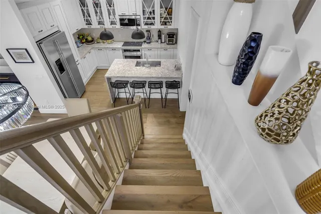 a bedroom with furniture and a flat screen tv