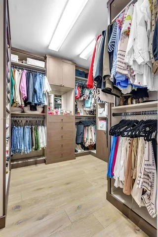 a bed room with two bed and a large window