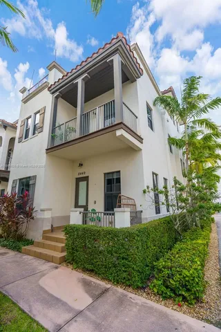 a view of a building with a yard