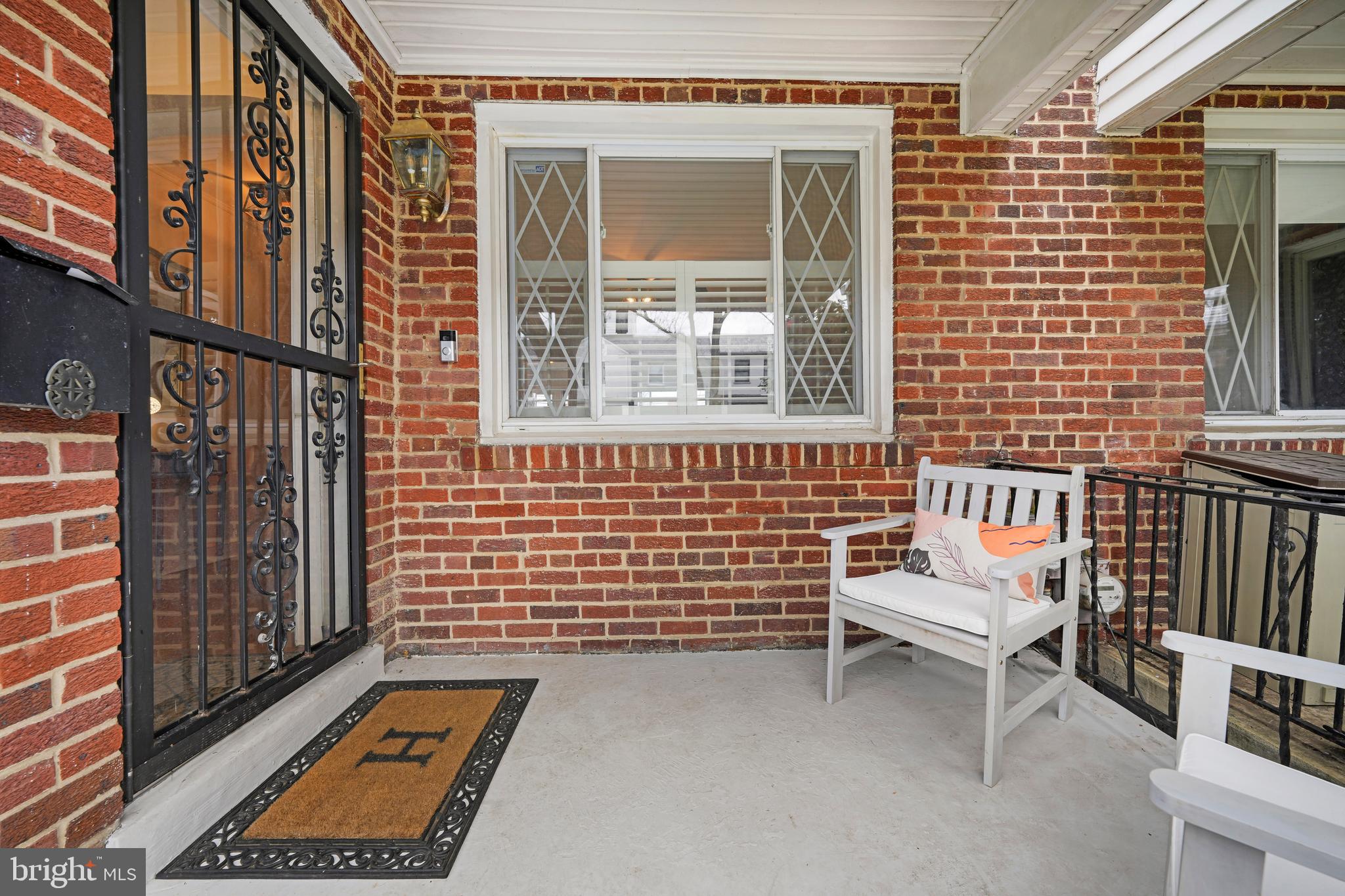 a view of front door with outdoor seating
