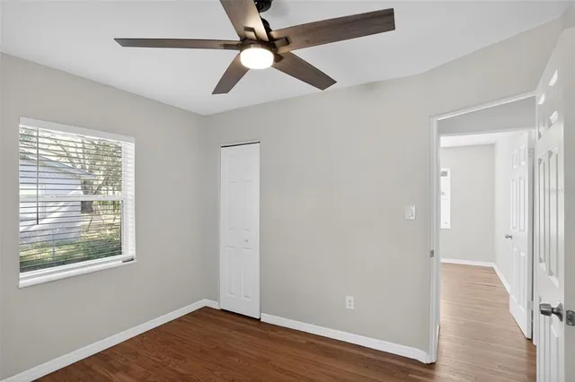 a view of a road with a tree in the background