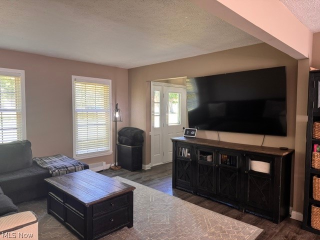 2760 Haines Road Madison, OH 44057 - Photo 21 of 33 Spacious living area featuring wood-finish flooring, two large windows with blinds, and a white entry door