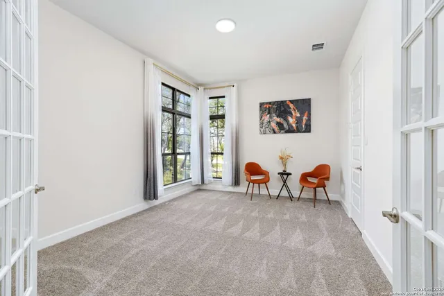 a view of a livingroom with an empty space and a fireplace