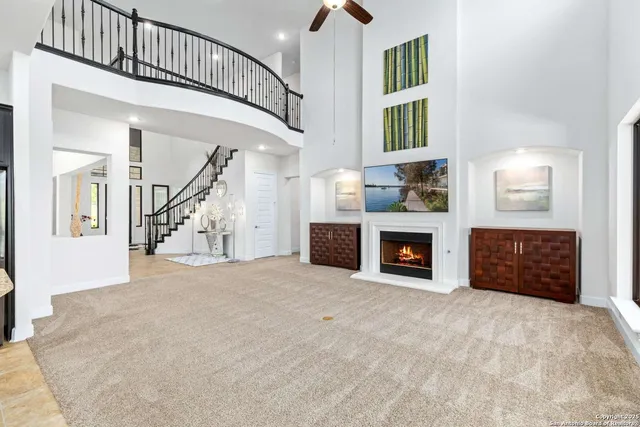 a view of kitchen with kitchen island and stainless steel appliances
