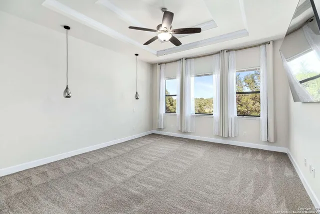 a room with a table chair sink and mirror