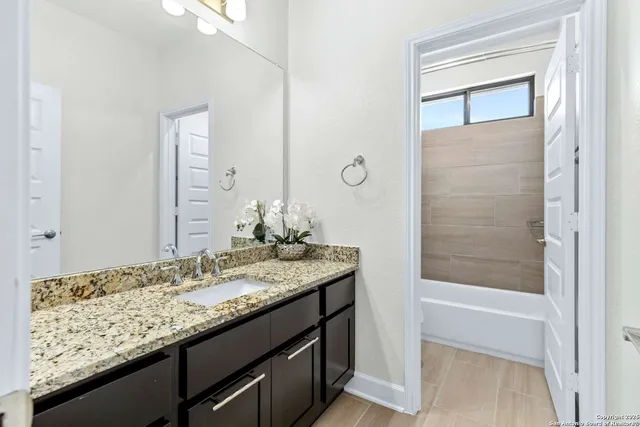 a close view of bathroom sink with tub